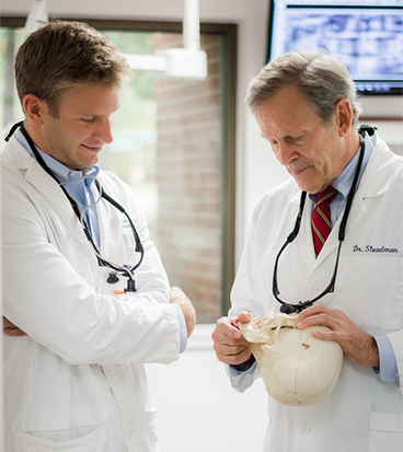 dentists discussing the effects of gum disease